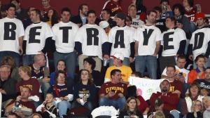 Image: Cleveland Cavaliers fans in Ohio wear shirts expressing their disappointment towards LeBron James, who was with the Cavaliers for seven years before leaving to play for the Miami Heat